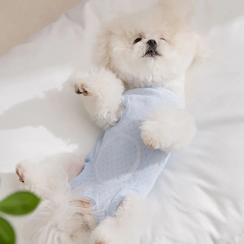 Soft yellow mesh pet shirt with cartoon cat patch and button closure on a small dog or cat