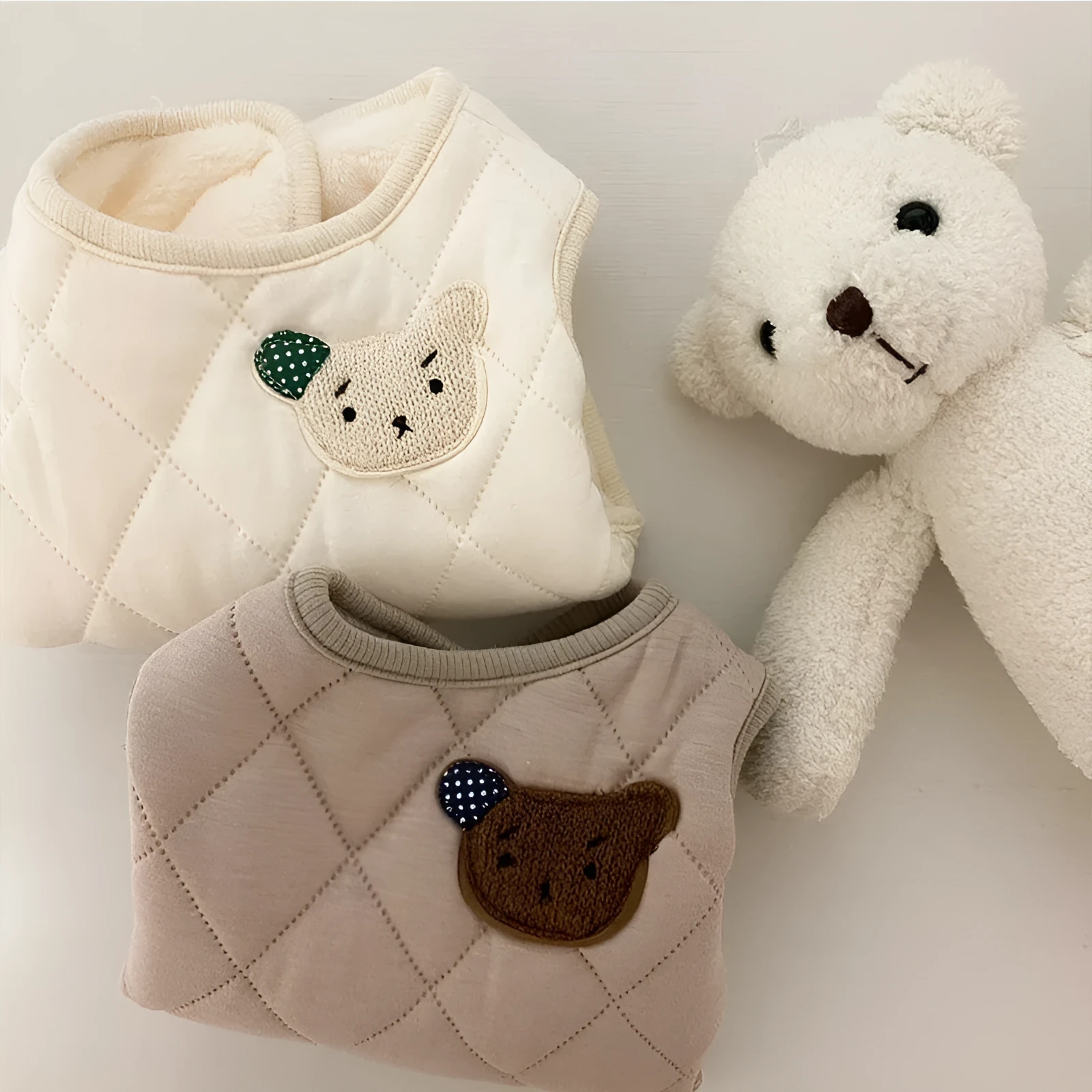 Quilted pet vest with embroidered bear patch and polka-dot ears, cream beige colour, for small dogs, side view