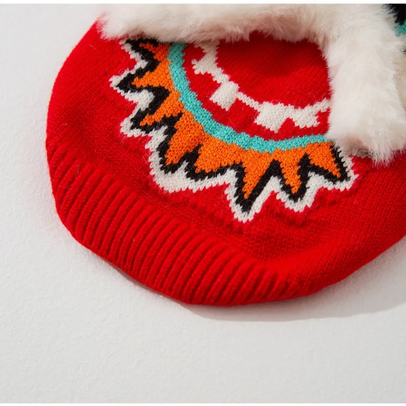 Red knitted lion dance pet sweater with 3D plush face details and colourful embroidery on a cat