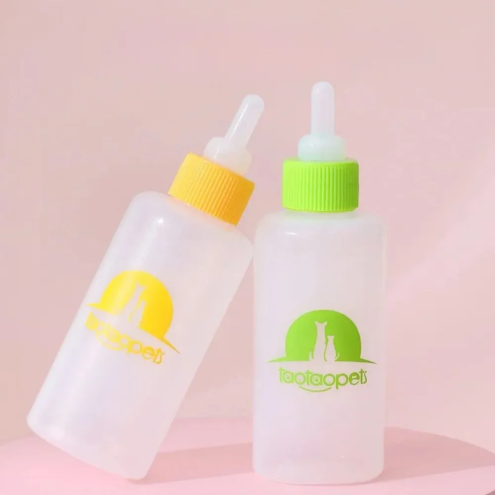 Set of four coloured pet milk bottles and a cleaning brush for feeding small animals