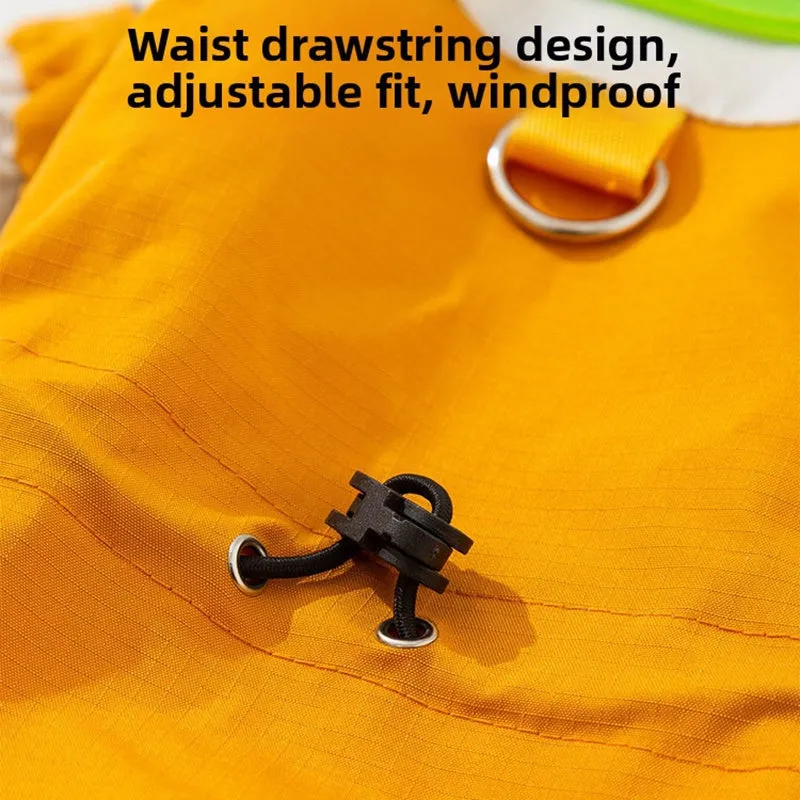 Reflective colour block dog jumpsuit in blue with waterproof fabric, four-leg coverage, and adjustable drawstrings on a small dog