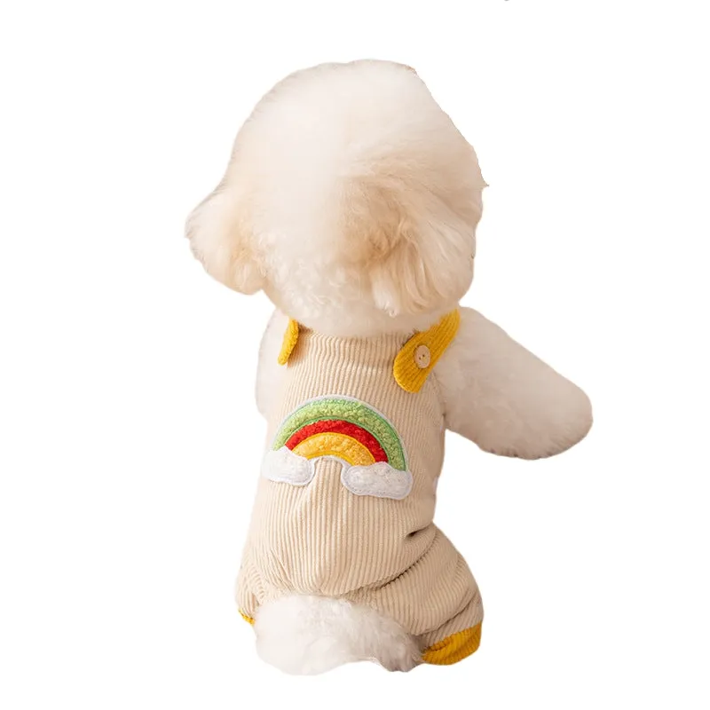 Small dog wearing beige corduroy overalls with rainbow print, autumn winter outfit