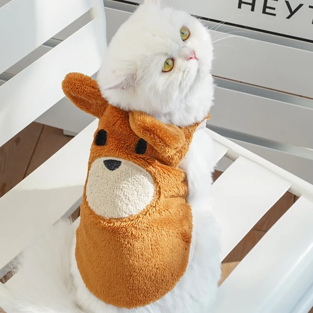 Fleece-lined warm dog clothes in cream with brown bear ears on a small dog