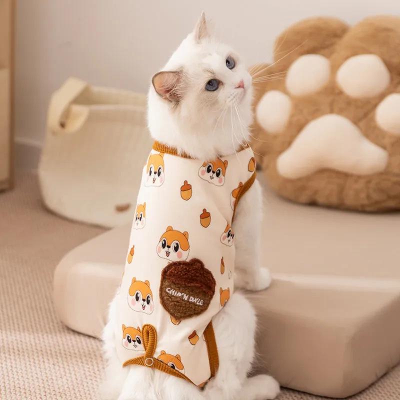 Small dog wearing Chip 'n' Dale themed cream onesie with yellow trim and embroidered acorn pocket