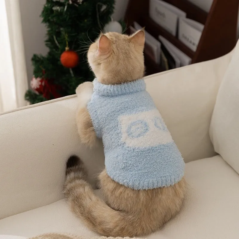 Cute blue and purple owl pattern pet sweater on a small cat or dog for winter