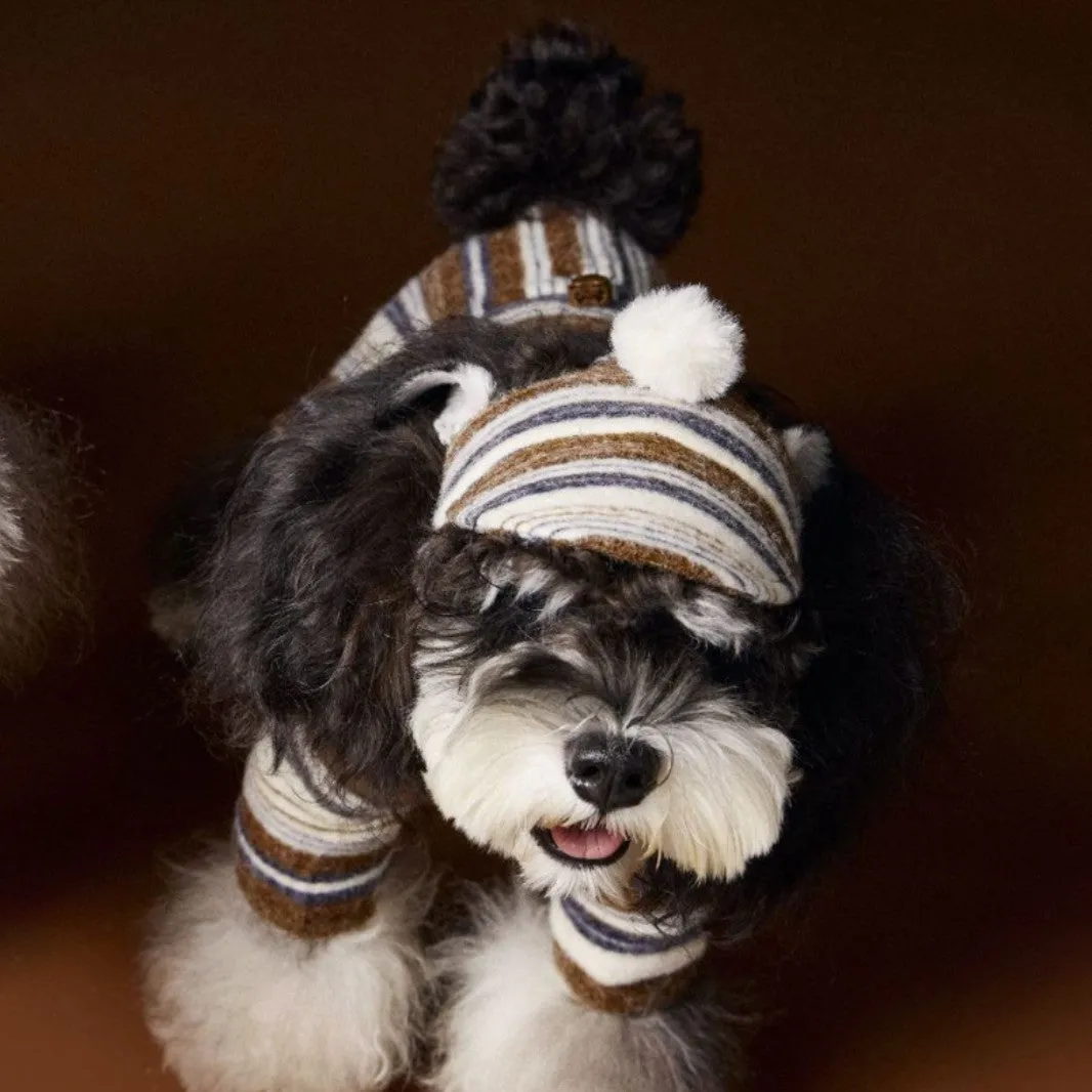 Striped fur ball acrylic dog hat in pink and coffee colours on display showing side view
