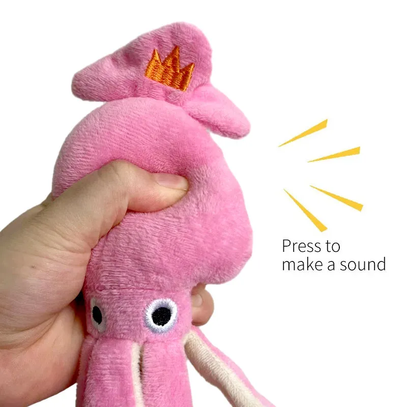Pink squid-shaped plush dog toy with rope texture and a built-in squeaker.