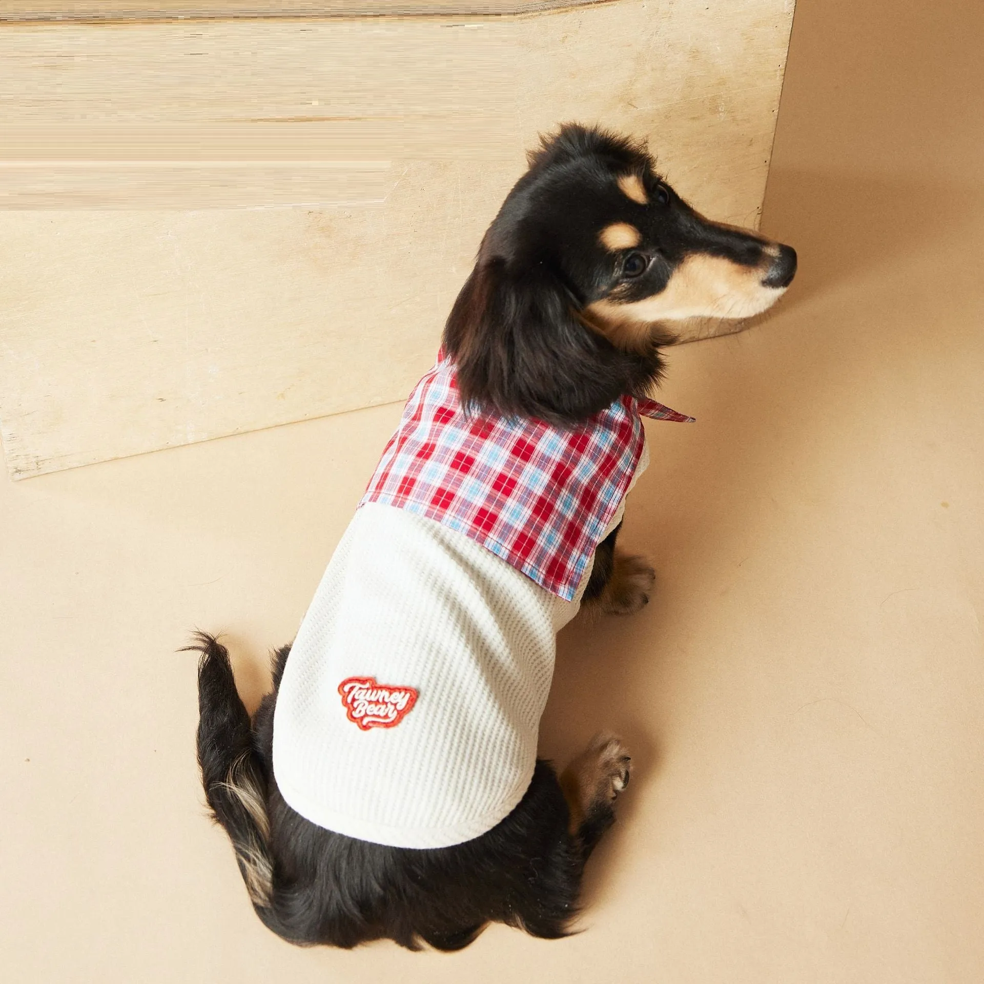 Sailor collar sleeveless dog vest in beige polyester, side view on a small breed dog