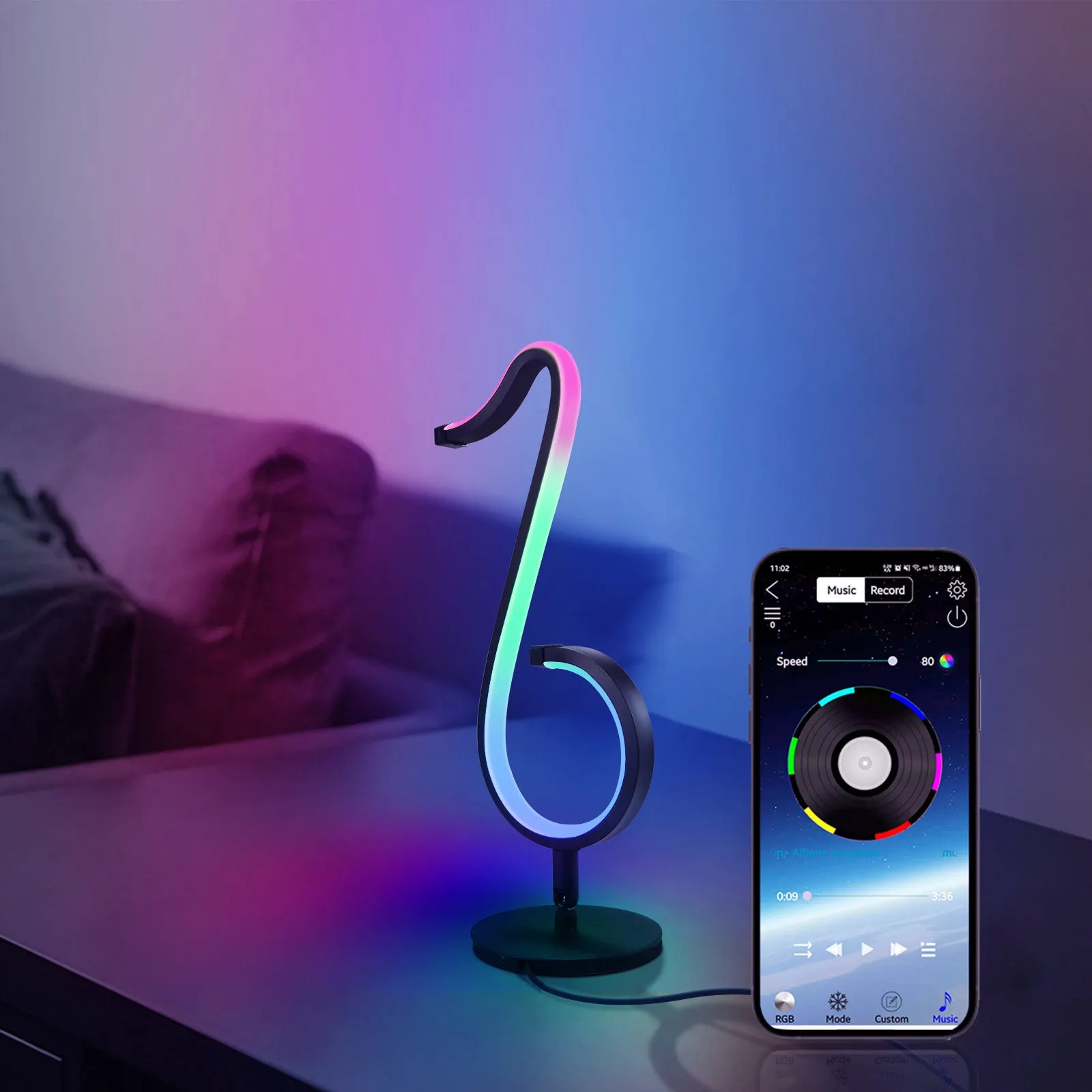 Black aluminium and iron APP-controlled LED atmosphere light with remote, showing 180-degree rotation on a desk.