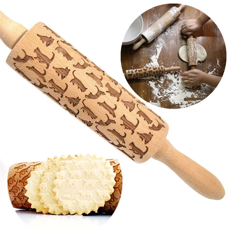 Wooden rolling pin with embossed Christmas patterns, 45cm long, on a kitchen worktop.