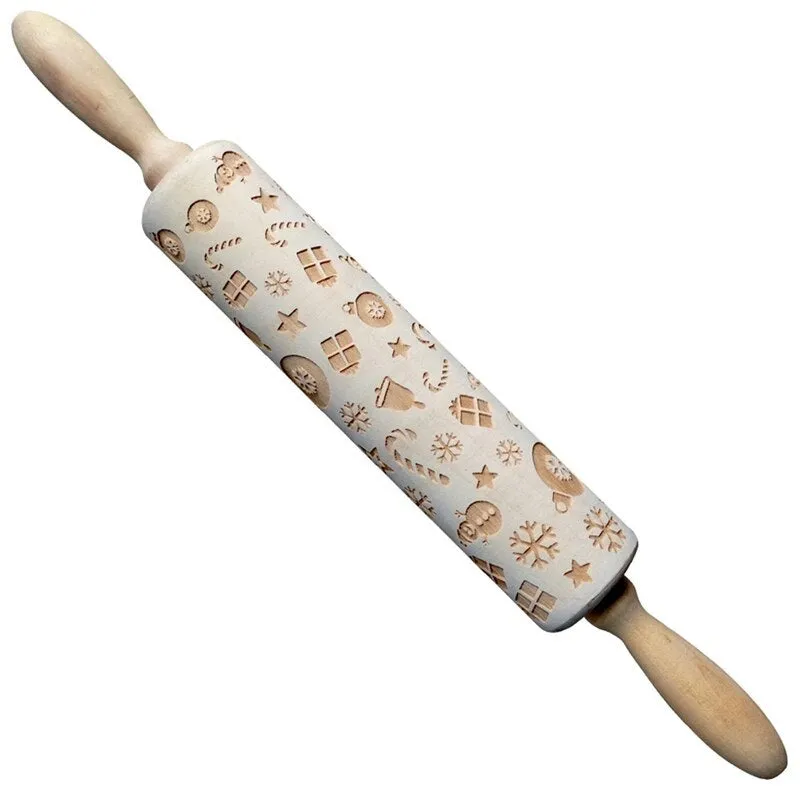 Wooden rolling pin with embossed Christmas patterns, 45cm long, on a kitchen worktop.