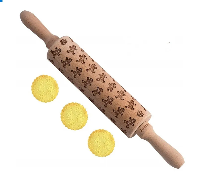 Wooden rolling pin with embossed Christmas patterns, 45cm long, on a kitchen worktop.