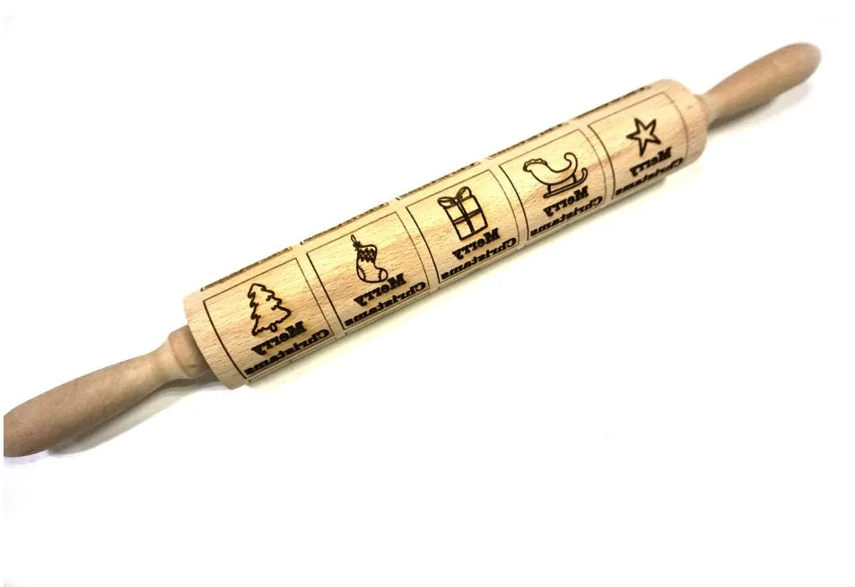 Wooden rolling pin with embossed Christmas patterns, 45cm long, on a kitchen worktop.