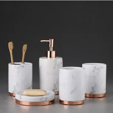 Ceramic bathroom set showing bright glaze emulsion bottle, cup, toothbrush holder, and soap dish with applique detailing.