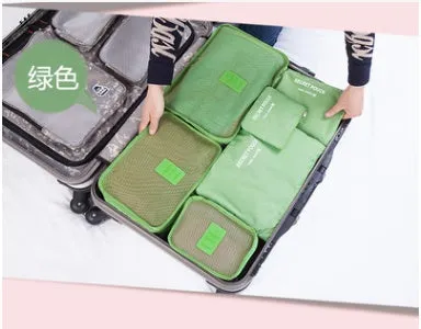 Set of six waterproof nylon packing cubes and organisers in assorted colours and sizes.