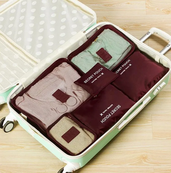 Set of six waterproof nylon packing cubes and organisers in assorted colours and sizes.