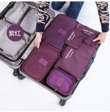 Set of six waterproof nylon packing cubes and organisers in assorted colours and sizes.