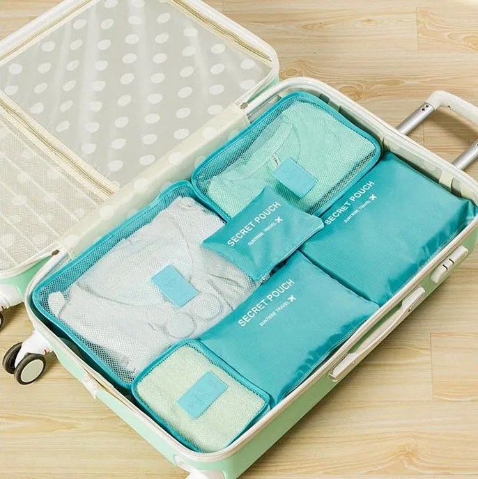 Set of six waterproof nylon packing cubes and organisers in assorted colours and sizes.