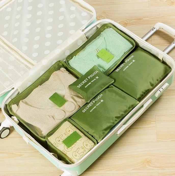 Set of six waterproof nylon packing cubes and organisers in assorted colours and sizes.