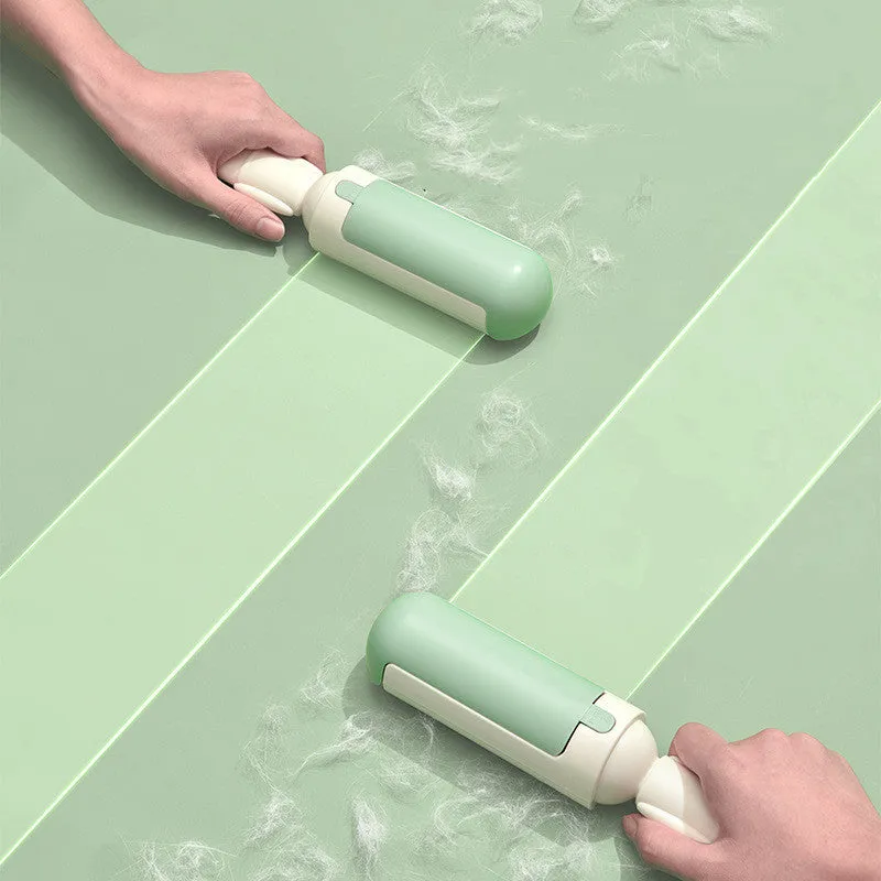 White green reusable pet hair remover roller with non-slip handle on a carpet.