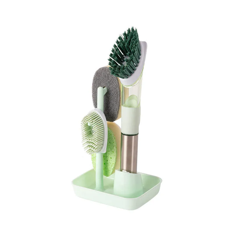 Long handled kitchen cleaning brush with a soap dispenser button and a stainless steel scouring block.