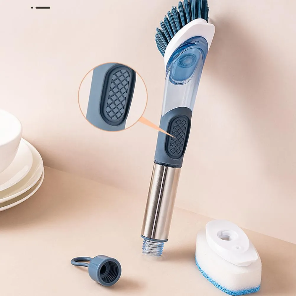Long handled kitchen cleaning brush with a soap dispenser button and a stainless steel scouring block.