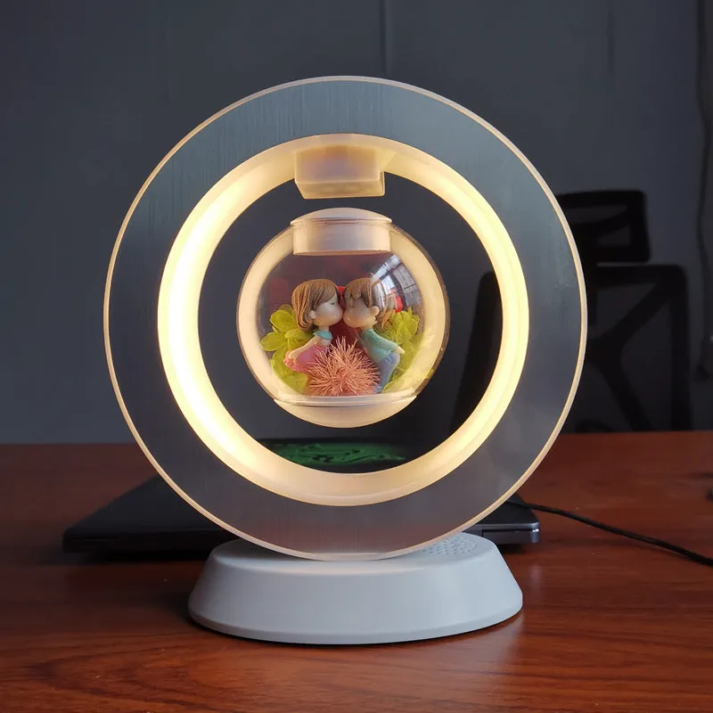 Pink floating heart LED levitation lamp with eternal flower on triangular base.