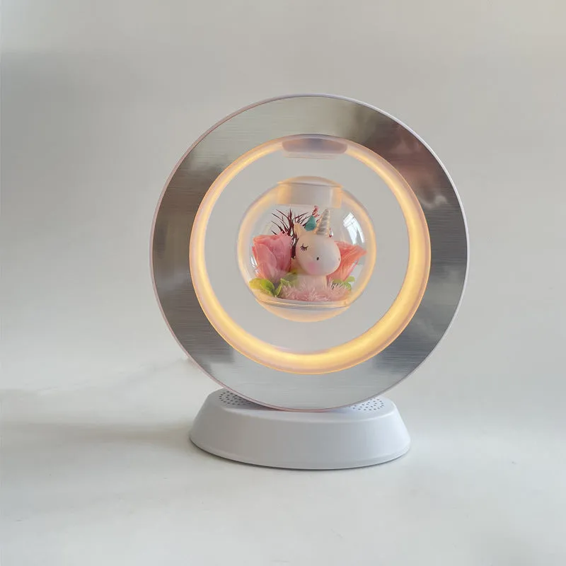 Pink floating heart LED levitation lamp with eternal flower on triangular base.