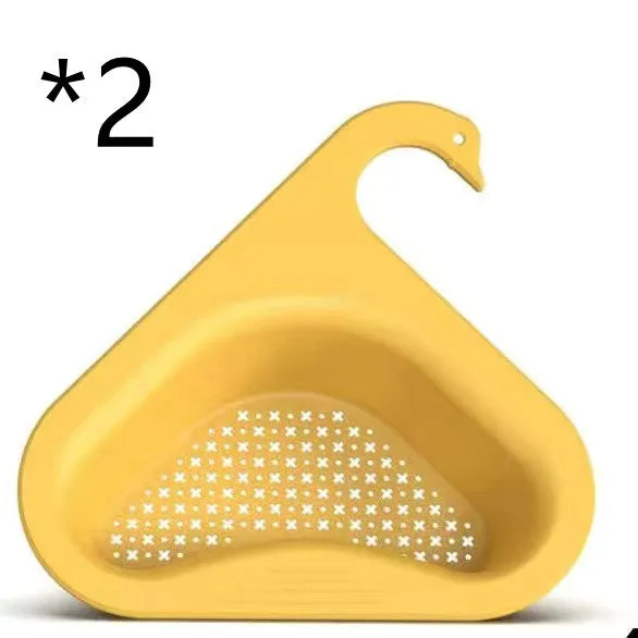 Household sink hanging fruit and vegetable drain basket in green plastic, clipped onto sink rim with slotted base
