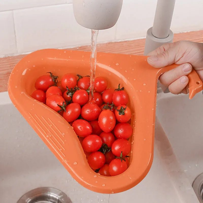 Household sink hanging fruit and vegetable drain basket in green plastic, clipped onto sink rim with slotted base