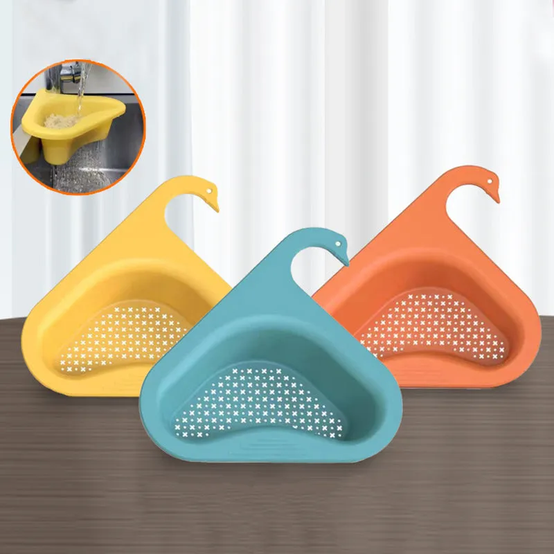 Household sink hanging fruit and vegetable drain basket in green plastic, clipped onto sink rim with slotted base
