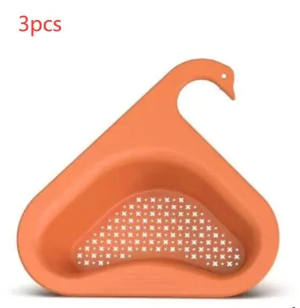 Household sink hanging fruit and vegetable drain basket in green plastic, clipped onto sink rim with slotted base