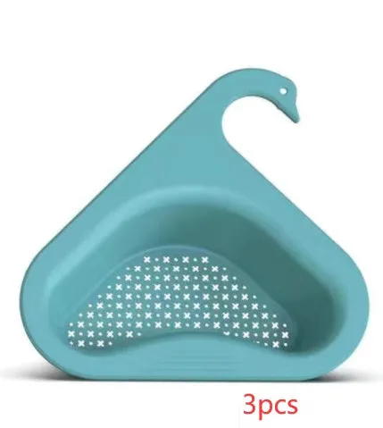 Household sink hanging fruit and vegetable drain basket in green plastic, clipped onto sink rim with slotted base