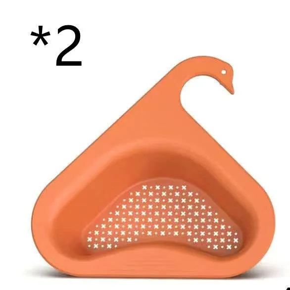 Household sink hanging fruit and vegetable drain basket in green plastic, clipped onto sink rim with slotted base
