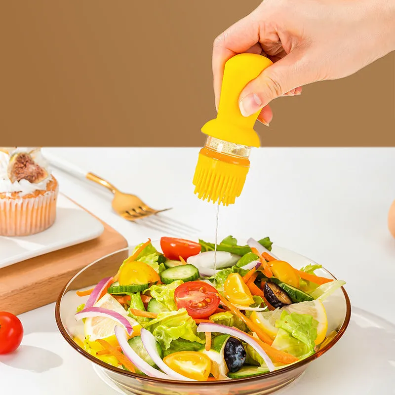 Transparent glass oil dispenser with silicone brush, stainless steel nozzle, in yellow, green, or brown.