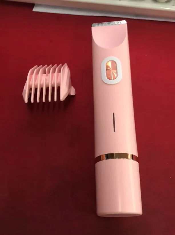 Pink women's electric razor and trimmer with two heads, USB cable, and brush on a white background.