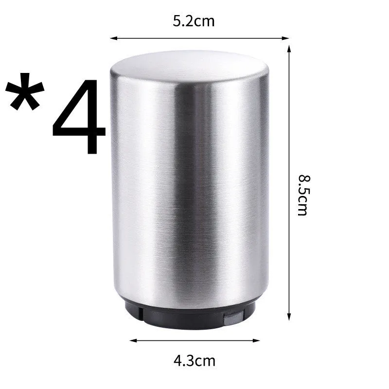 Stainless steel automatic bottle opener on a table, showing its compact size and press-down design.