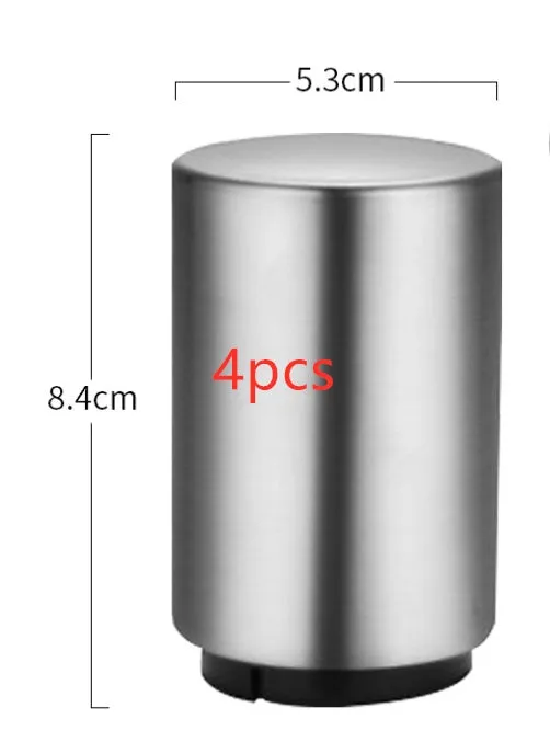 Stainless steel automatic bottle opener on a table, showing its compact size and press-down design.