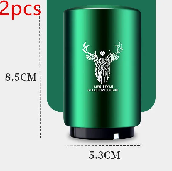 Stainless steel automatic bottle opener on a table, showing its compact size and press-down design.