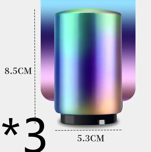 Stainless steel automatic bottle opener on a table, showing its compact size and press-down design.