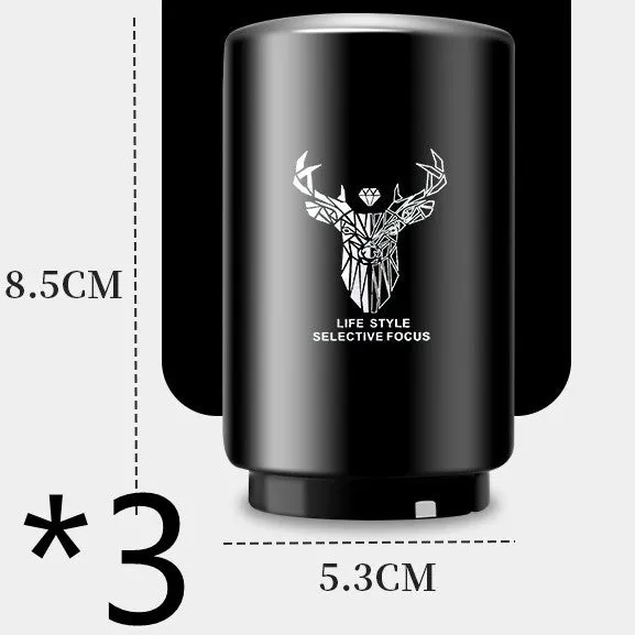 Stainless steel automatic bottle opener on a table, showing its compact size and press-down design.