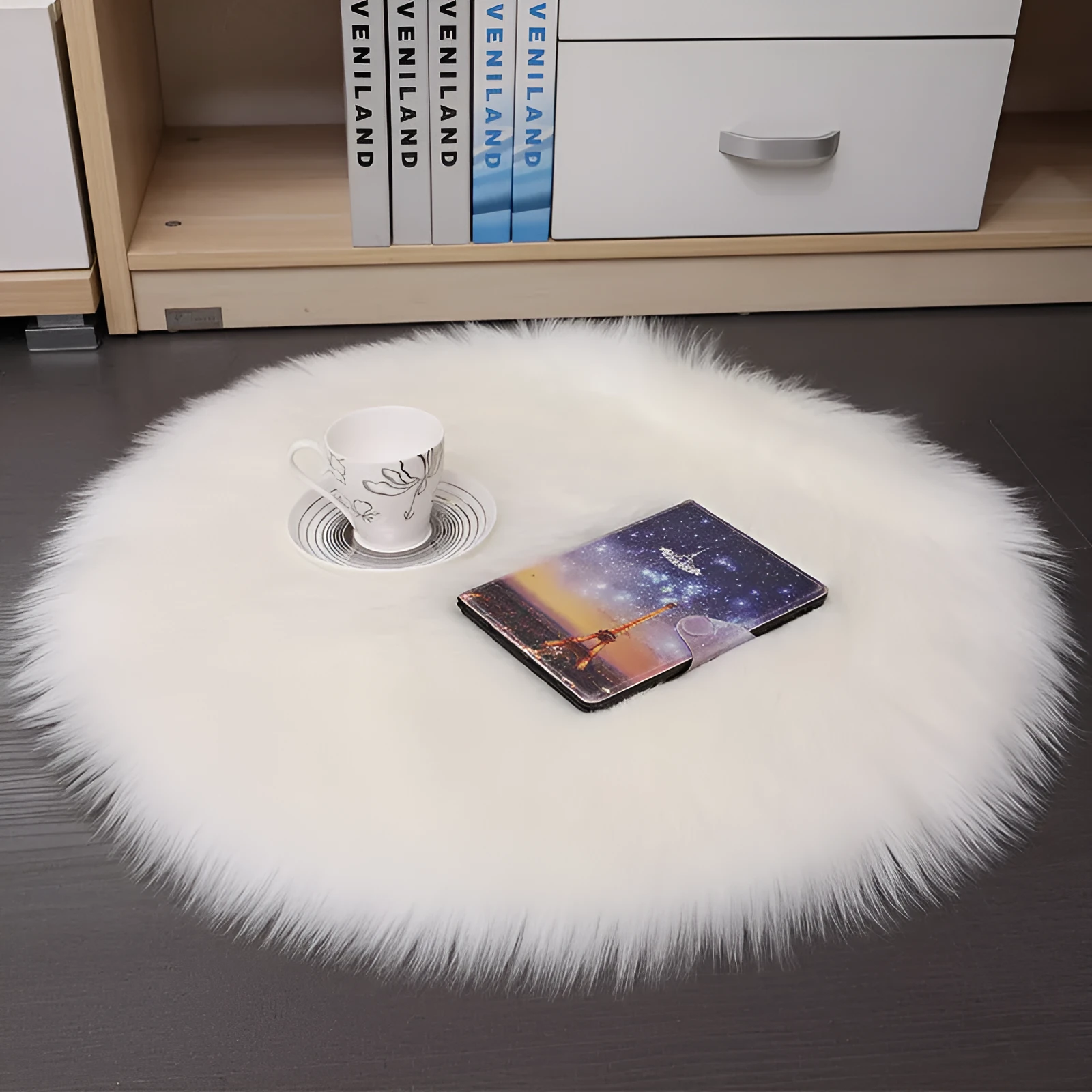 Round beige wool plush carpet floor mat on a wooden floor.