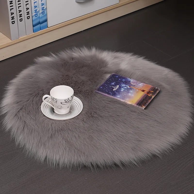 Round beige wool plush carpet floor mat on a wooden floor.