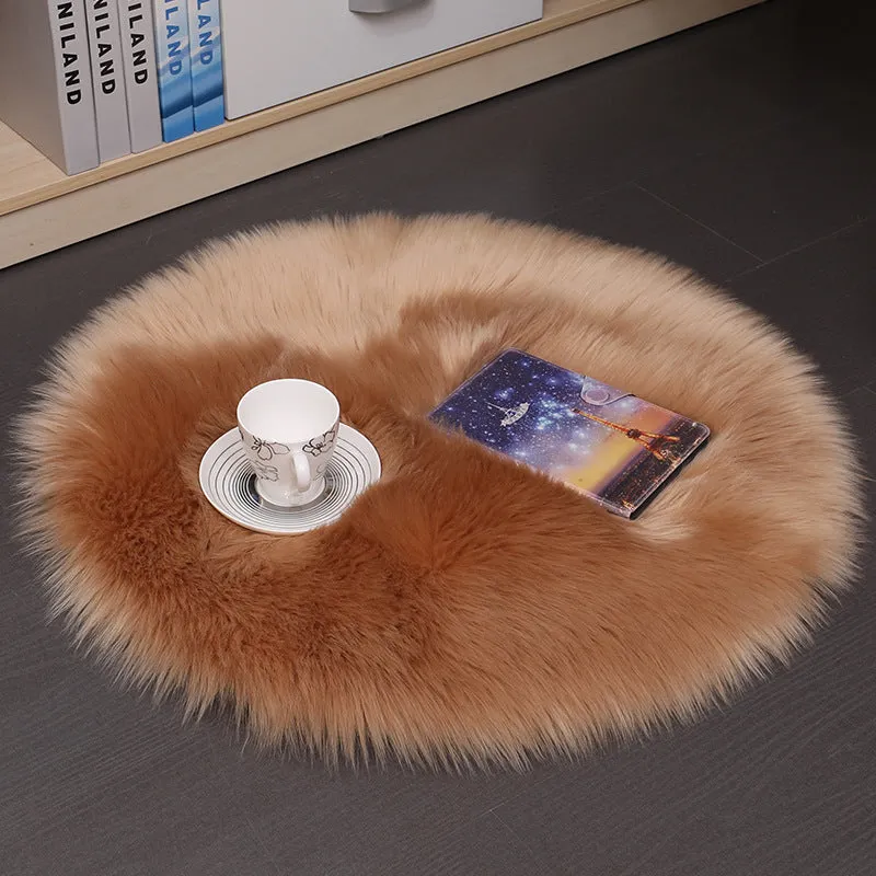 Round beige wool plush carpet floor mat on a wooden floor.