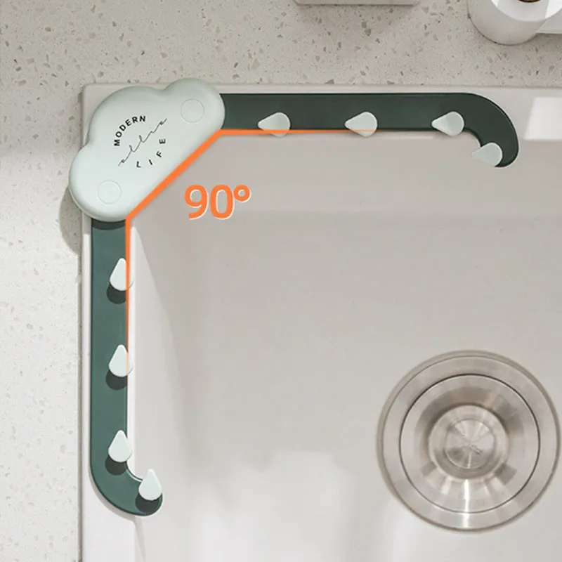 Grey triangular sink drain rack with a disposable filter mesh bag installed in a kitchen sink.