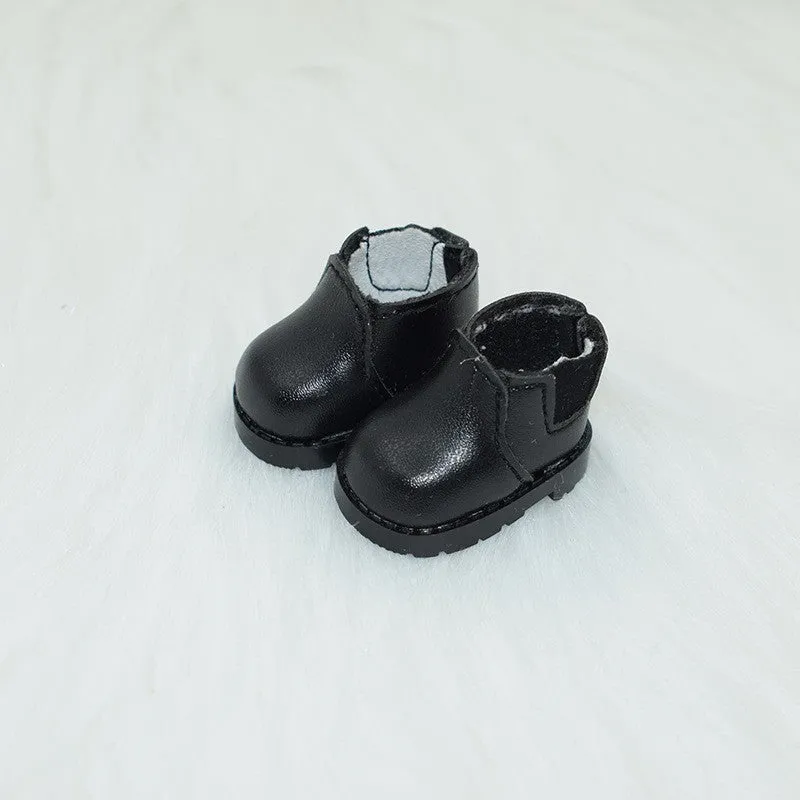 A pair of miniature PU replacement shoes for a 17cm fashion doll, shown in a selected style such as black boots.