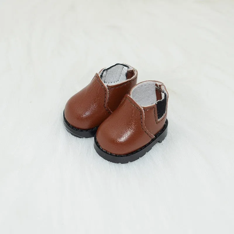 A pair of miniature PU replacement shoes for a 17cm fashion doll, shown in a selected style such as black boots.