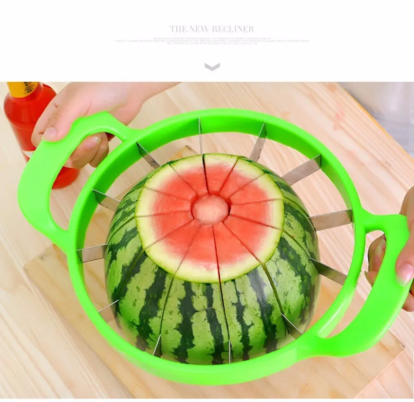 Green plastic melon slicer with stainless steel blades cutting a watermelon into wedges.
