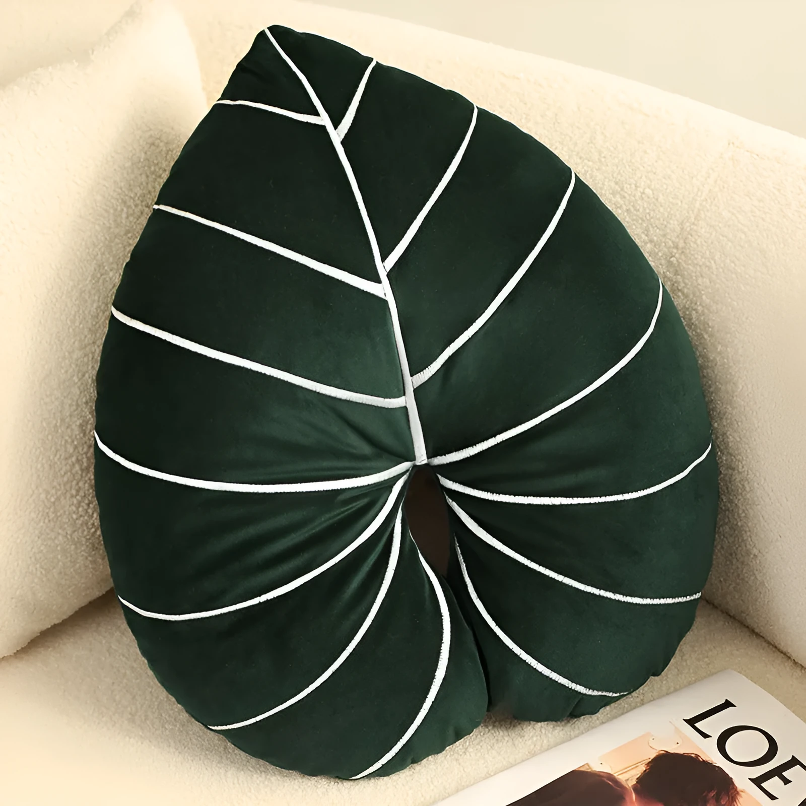 Large embroidered botanical cushion with Monstera deliciosa pattern on plush fabric