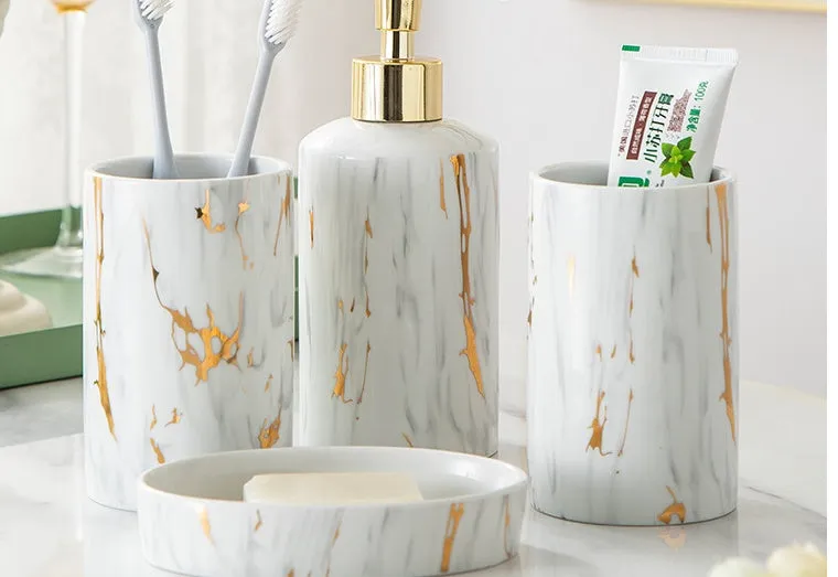 White ceramic bathroom wash kit with two cups, latex bottle and soap box in packaging